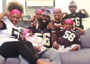 Celebratory family sitting on couch