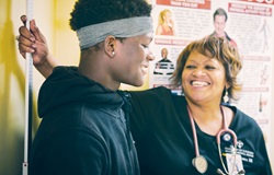 Nurse and patient smiling